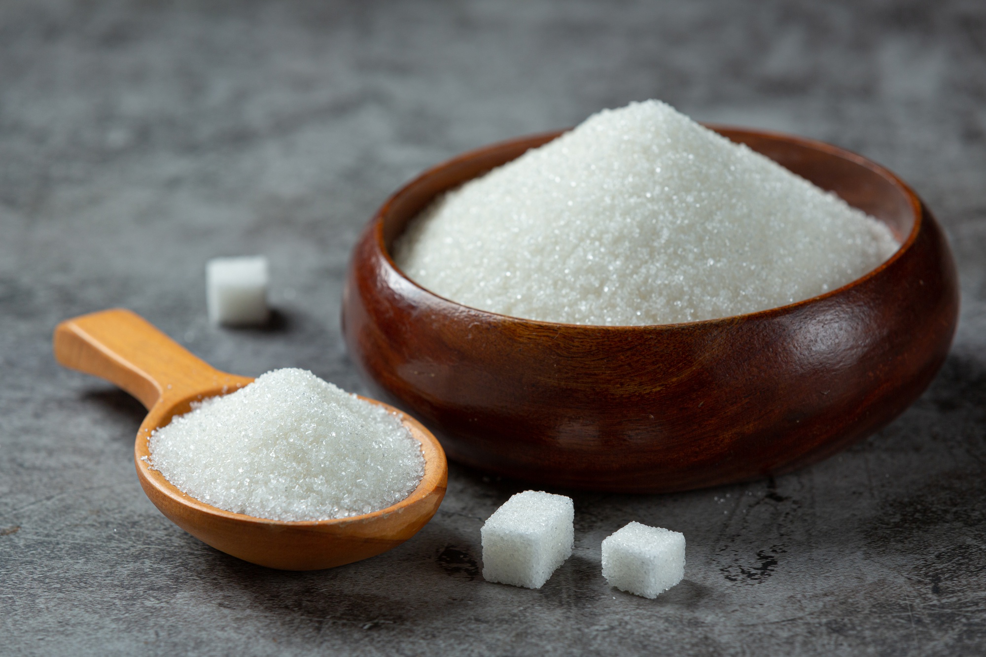 world-diabetes-day-sugar-wooden-bowl-dark-surface